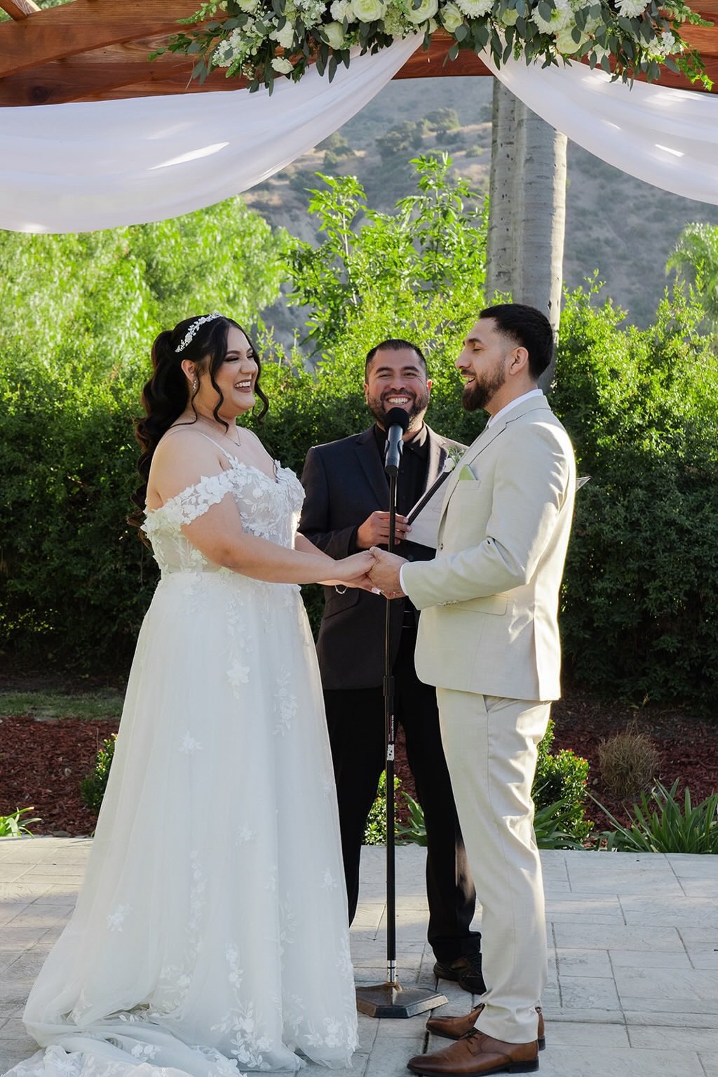 Bride groom and officiant laughing at Inland Empire ceremony